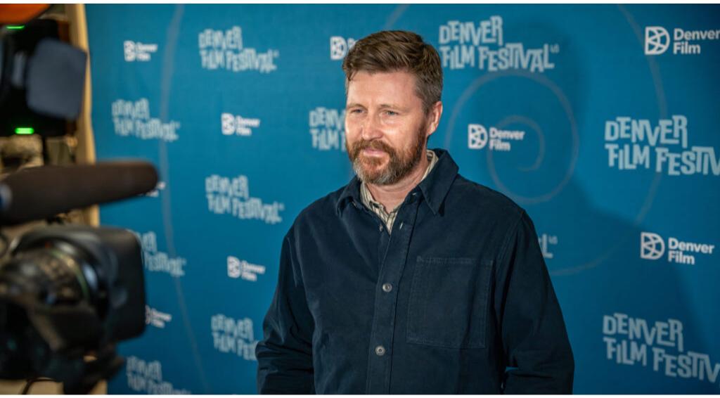 Man standing at Denver Film Festival press event