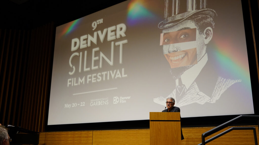 Speaker at podium during 9th Denver Silent Film Festival, May 20-22, Denver Botanic Gardens