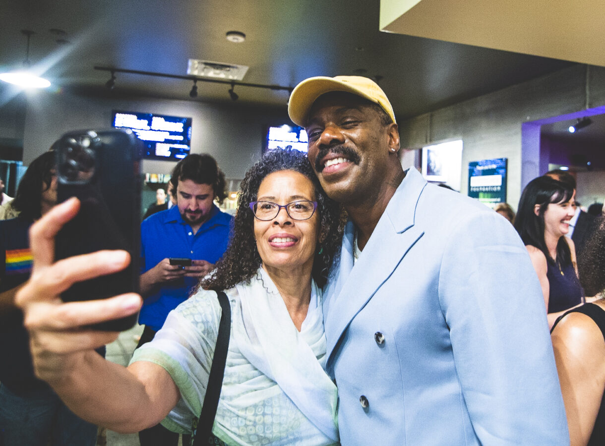 Friends-of-CQ-2.jpg showing people at an event taking selfies, smiling, balloons in background