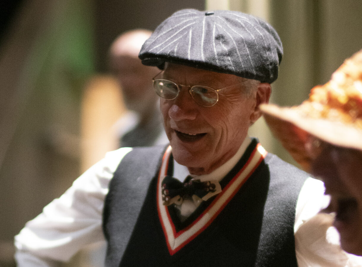 Friends-of-Silent.jpg shows a smiling man in vintage attire, wearing a cap and glasses