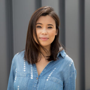 KANOP-Headshot.jpg shows a person in a denim shirt outdoors looking confident