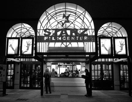 Starz FilmCenter entrance at night with people gathering