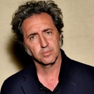 Paolo Sorrentino looking contemplative against a neutral background