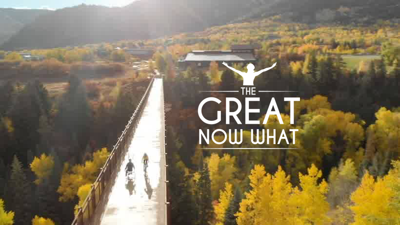 Two cyclists cross a scenic bridge; text reads "The Great Now What."