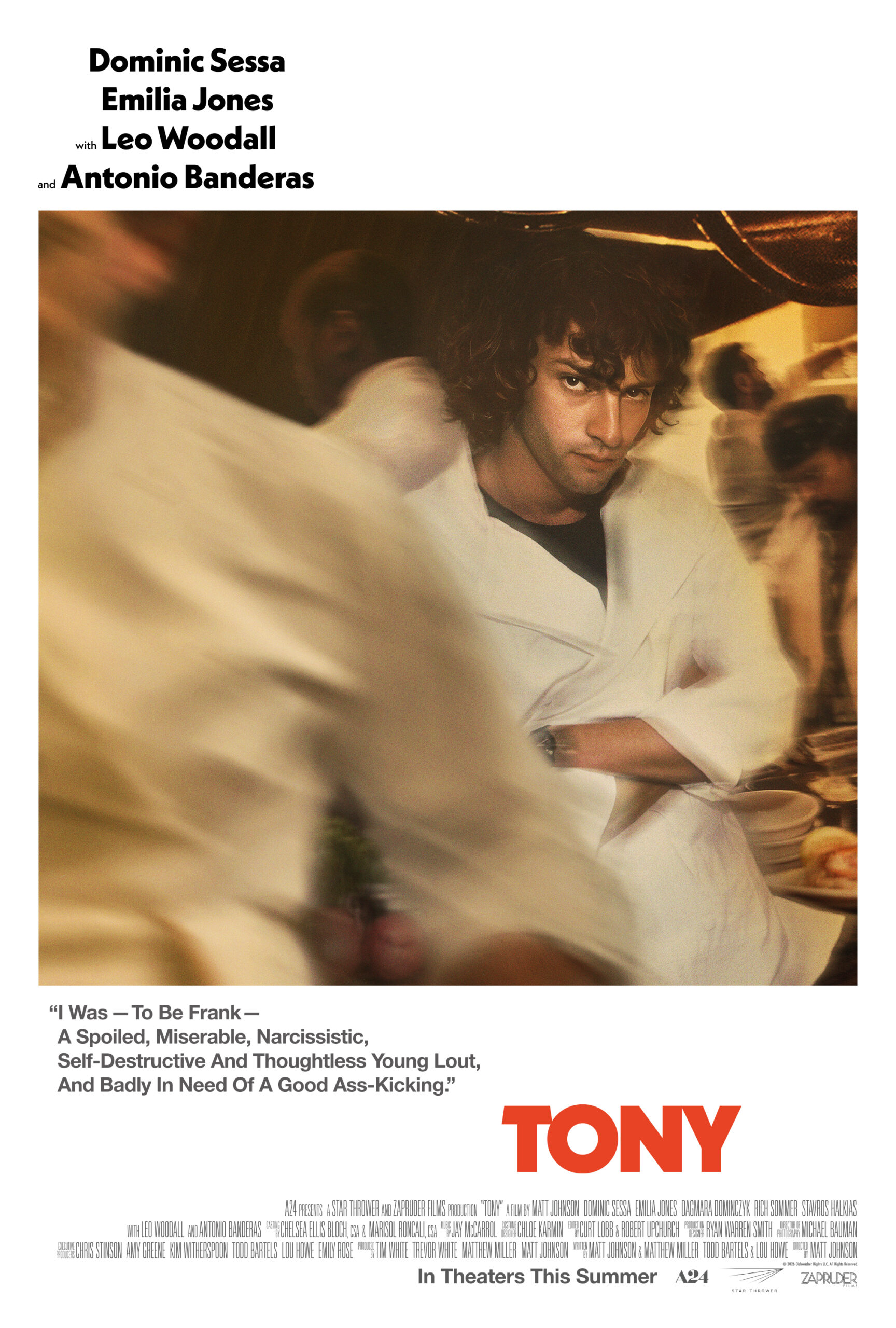 Dominic Sessa in chef's attire, looking intense, text: “I Was — To Be Frank — A Spoiled, Miserable, Narcissistic, Self-Destructive And Thoughtless Young Lout, And Badly In Need Of A Good Ass-Kicking.” Cast: Dominic Sessa, Emilia Jones, Leo Woodall, Antonio Banderas. Title: TONY. In Theaters This Summer